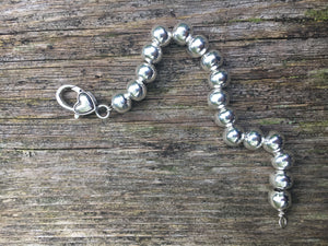 Bracelet - clasped 10 mm hollow silver beads on chain