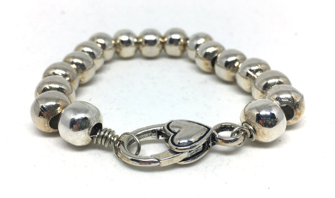 Bracelet - clasped 10 mm hollow silver beads on chain